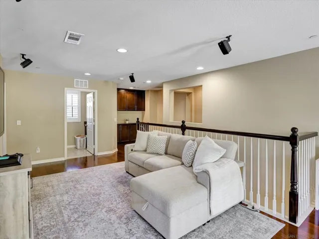 Beautiful loft overlooks the living room situated in between the primary bedroom and 3 guest bedrooms.