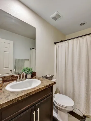 Located just adjacent to guest bedroom downstairs at entry!