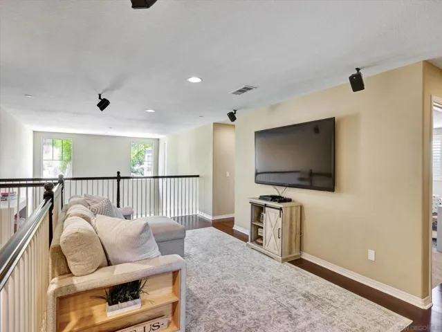 Beautiful loft overlooks the living room situated in between the primary bedroom and guest bedrooms.