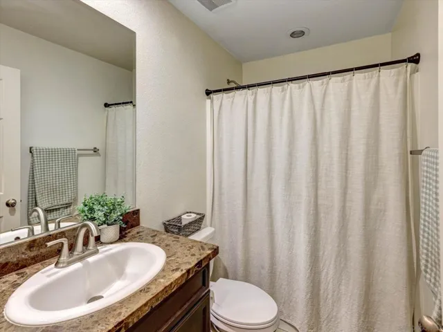 Located just adjacent to guest bedroom downstairs at entry!