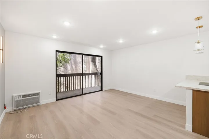 Spacious living area opens seamlessly to your private covered balcony.
