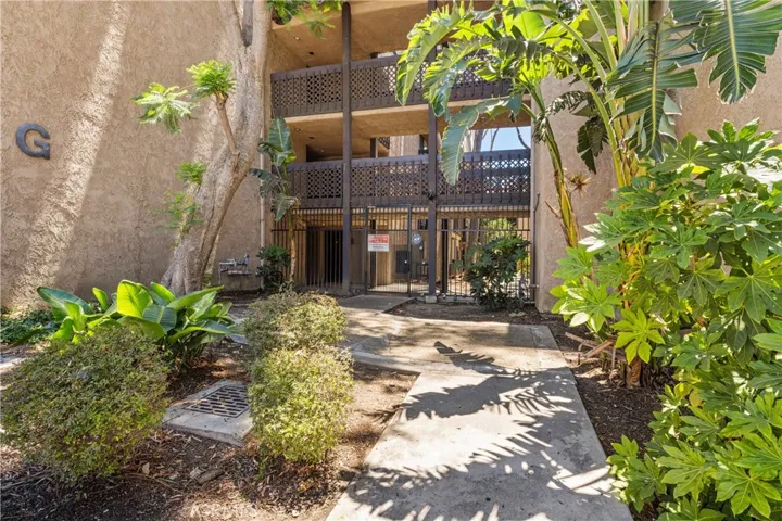 Secure gated entry with beautifully maintained grounds.