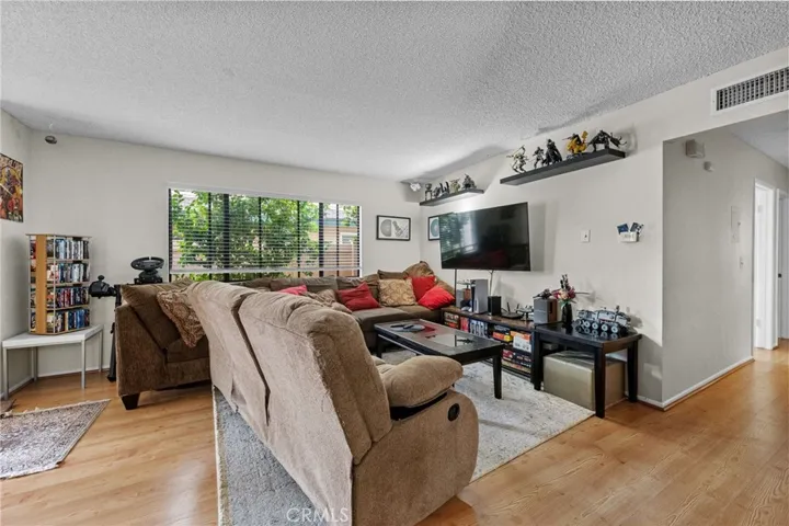 Spacious Living room. Wood look floors.