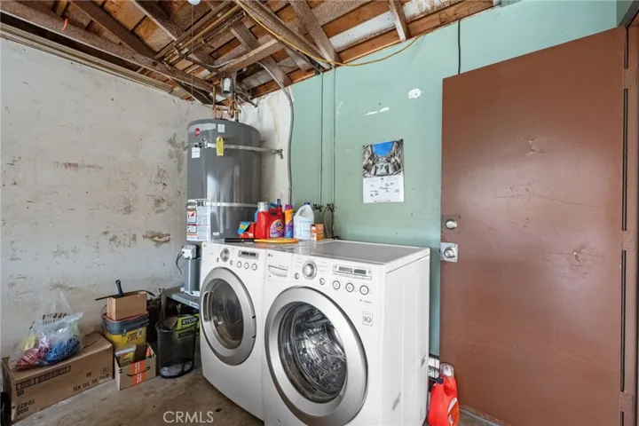 Laundry in garage 3 bedroom side. door to covered porch and entry.