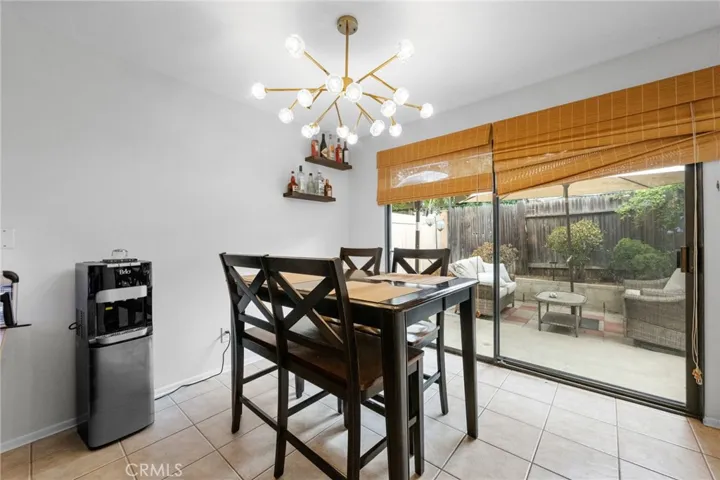 Dining area opens to the backyard.