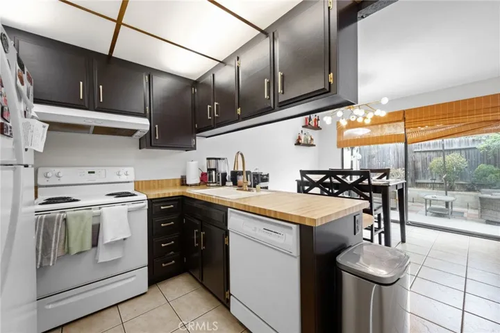 Black cabinets with brass pulls.