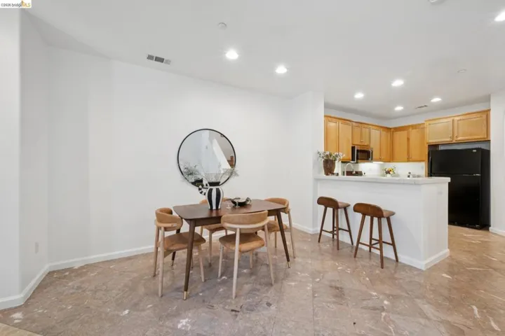 Open concept living area featuring natural stone flooring