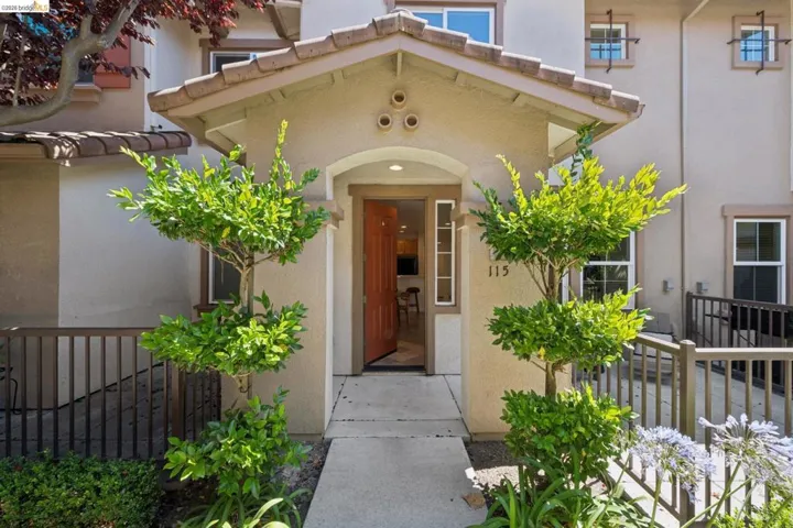 Stucco exterior with a terracotta tile roof accent