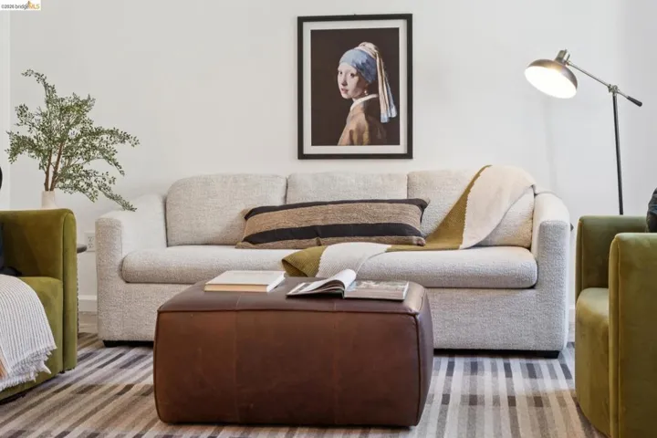 Light-colored wall finishes complement a low-pile striped area rug