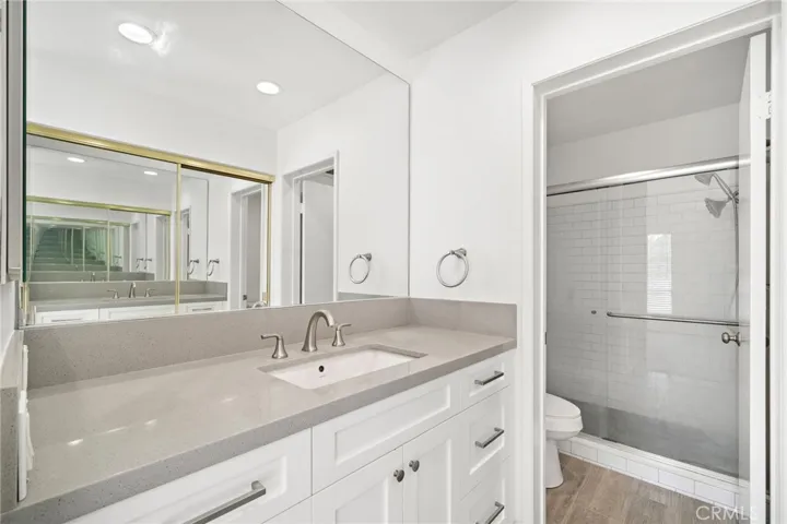 Serene primary suite offers a private en-suite bath.
