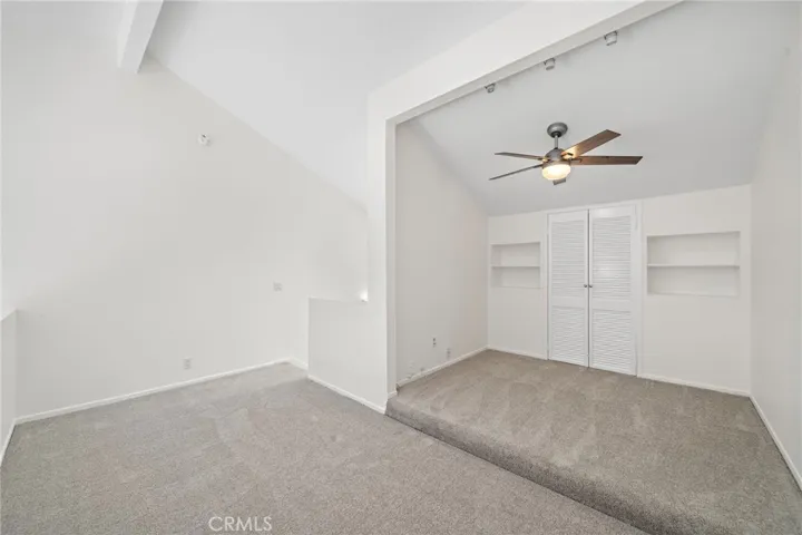 Directly above the main living space sits a spacious upper-level loft.