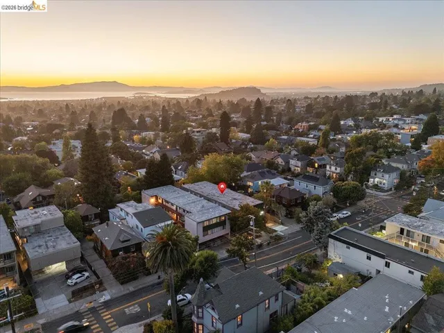 Aerial view of residential area with a mountainous background