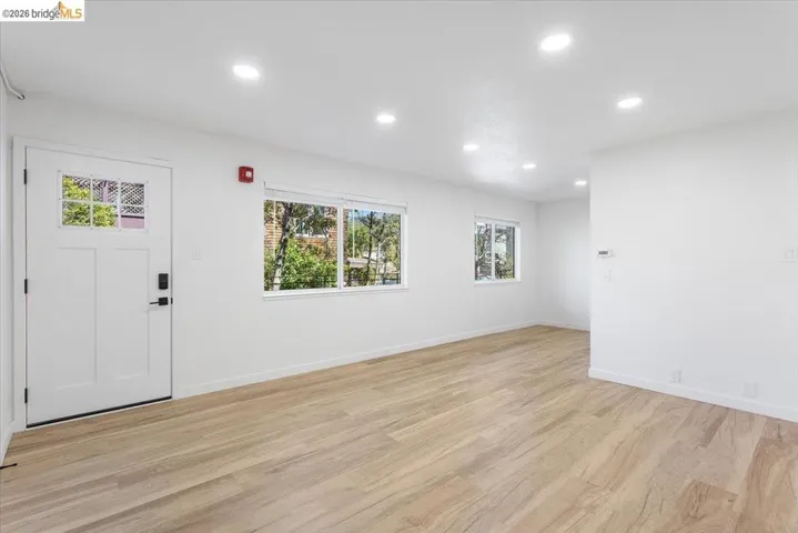 Foyer featuring light wood-type flooring and recessed lighting