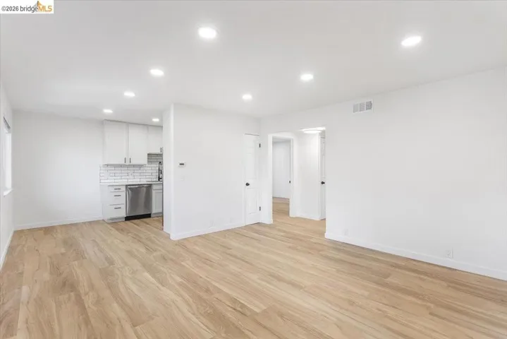 Unfurnished living room featuring recessed lighting and light wood-type flooring