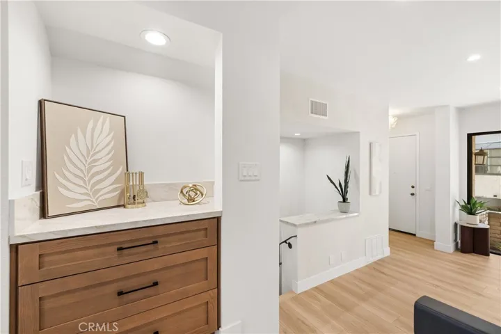 Former wet bar converted into convenient storage.