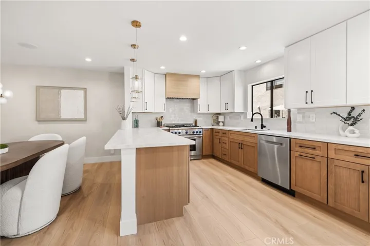 Spacious kitchen with real wood cabinetry.