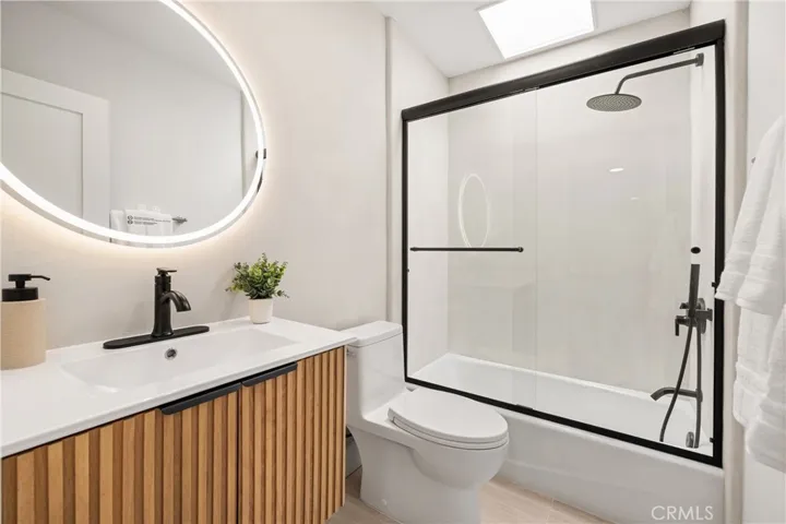 pdated upstairs hall bathroom featuring designer microcement finishes