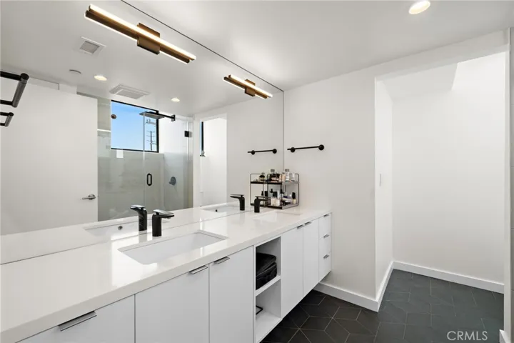 Expansive Primary bathroom with dual sinks.