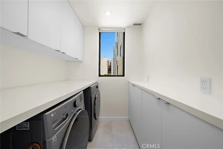 Kitchen adjacent laundry room.
