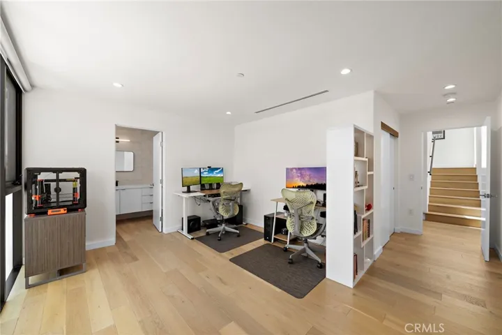 Bedroom 2 with en-suite bath and views to neighborhood.