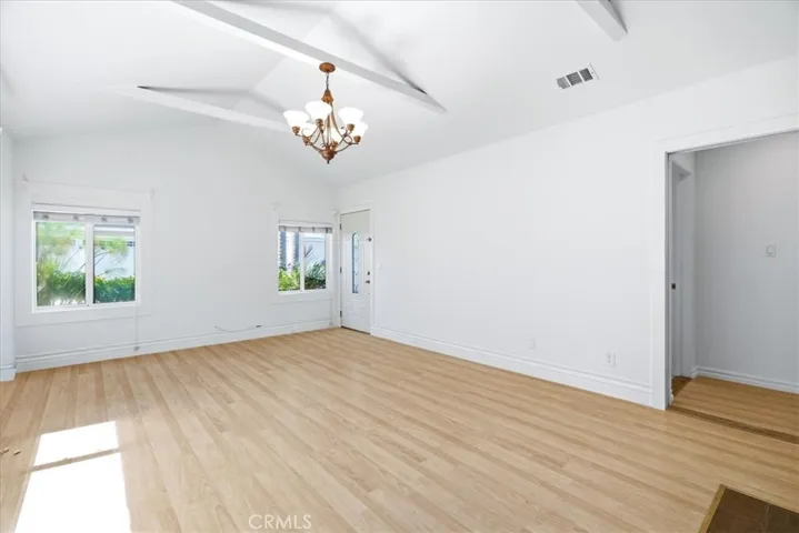 Open living space showcasing the flexible layout, bright interiors, and connection to the adjoining rooms.