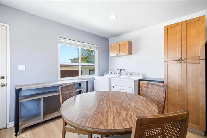 Additional view of the dining area highlighting the open-concept design, natural light, and comfortable gathering space.