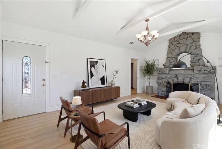 Living room perspective featuring the fireplace, comfortable seating area, and a welcoming space for relaxation.