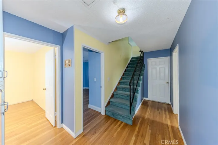 Hallway toward stairs and garage.