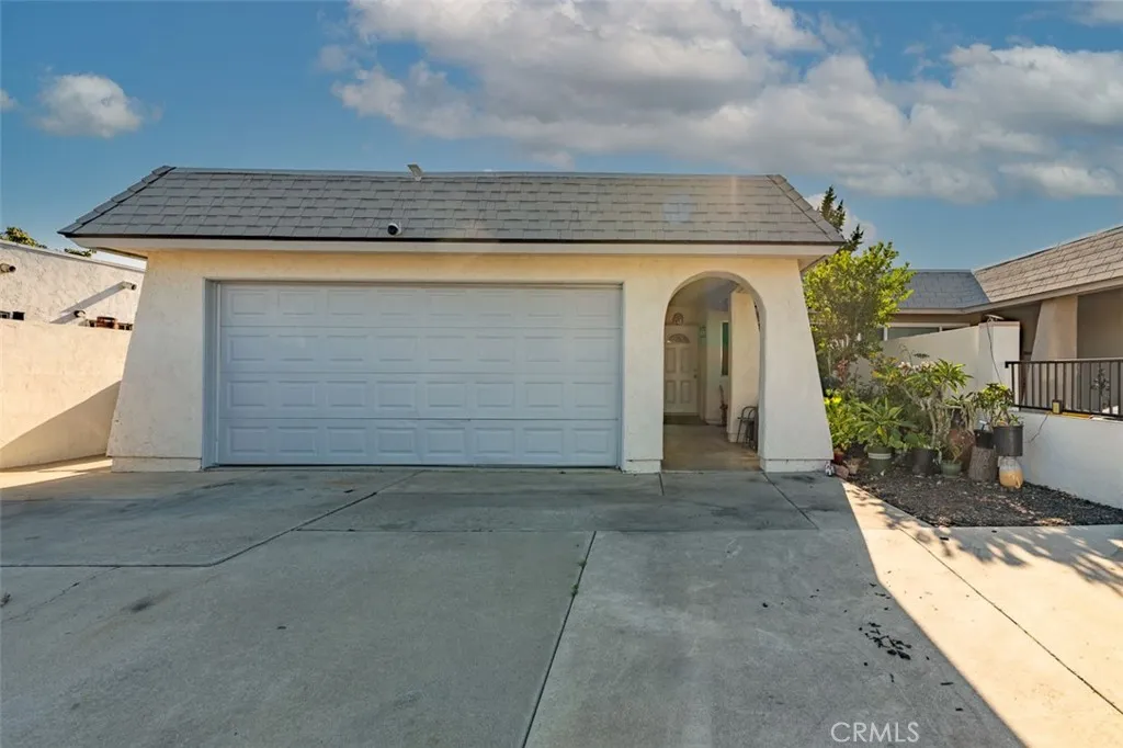 Attached two-car garage provides secure parking and extra storage.