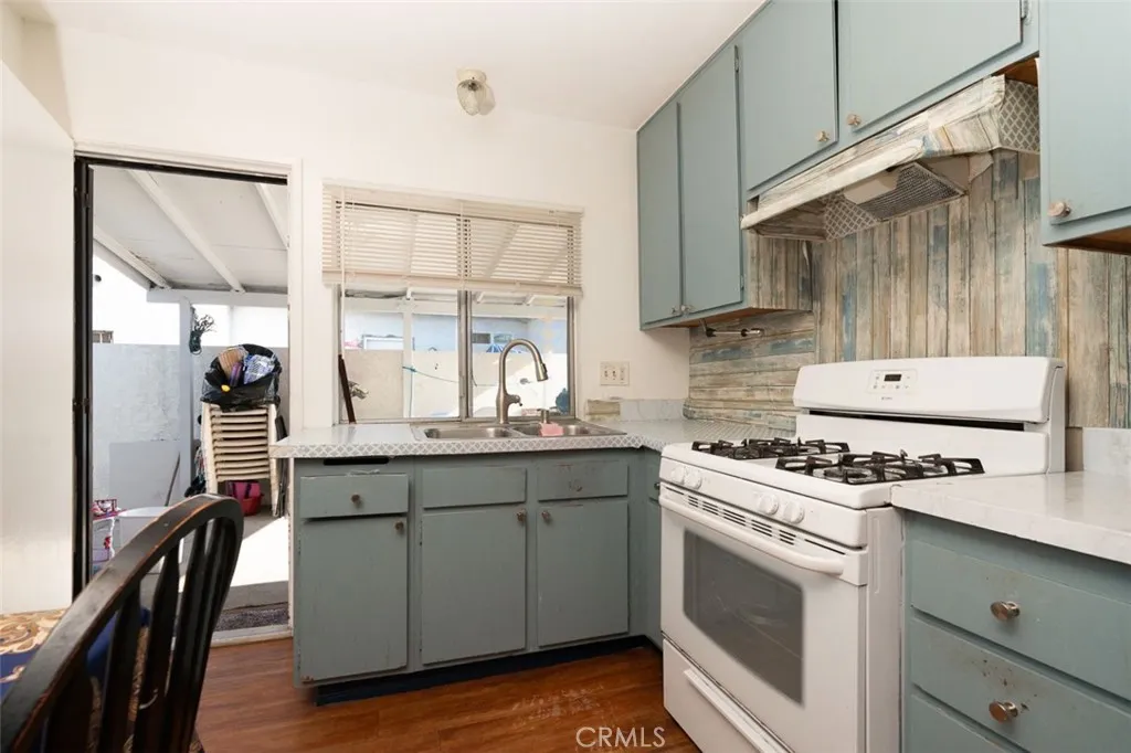 Functional kitchen featuring ample cabinetry and generous counter space.