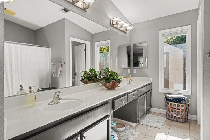Dual vanity with integrated sinks and chrome fixtures