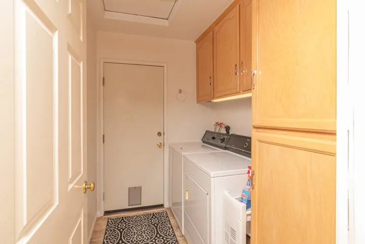 laundry room with built in cabinets