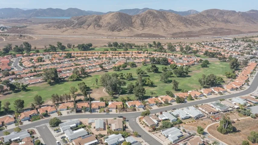 aerial view of the home, golf course behind