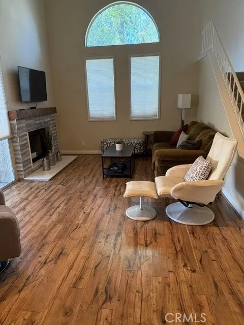 Living room with high ceils and a fireplace