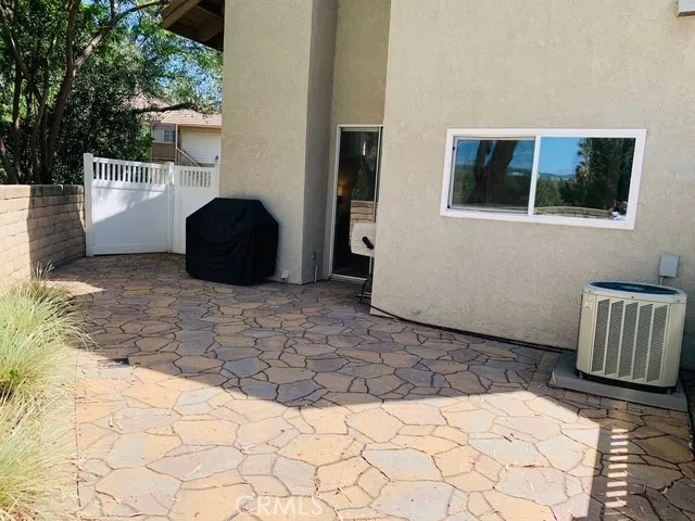 Back patio with access from both the kitchen and the living room..BBQ as well