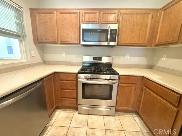 Kitchen has window that brings fresh air and plenty of counter space.