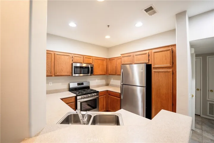 Kitchen with Stainless steel appliances.