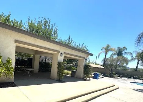 covered lounge area by the pool