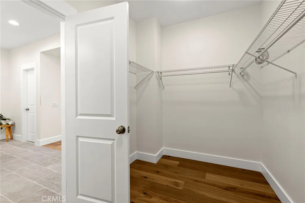 Primary walk-in closet Primary walk-in closet