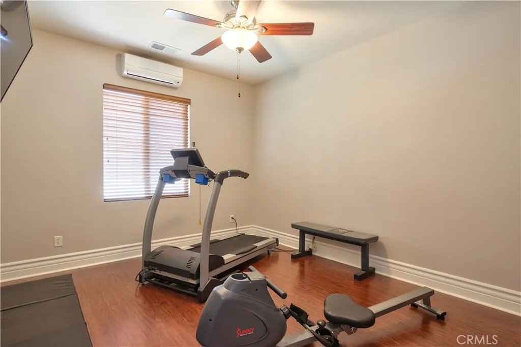 Bedroom at the end of the hall to the right exercise room w/mini split AC unit