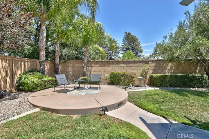 Sun Corner/optional fire pit area, located to the left of the sliding glass door exit to the patio
