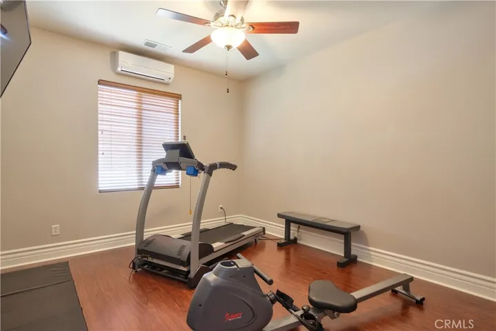 Bedroom at the end of the hall to the right exercise room w/mini split AC unit