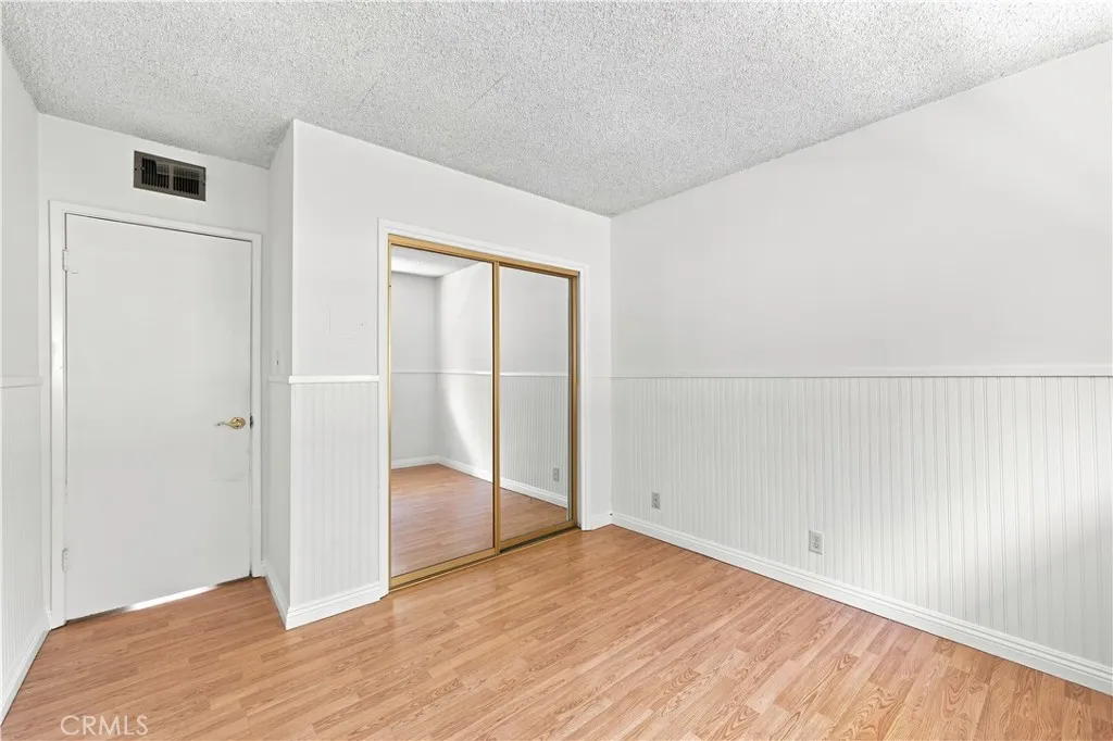 Entryway to 2nd bedroom & closet