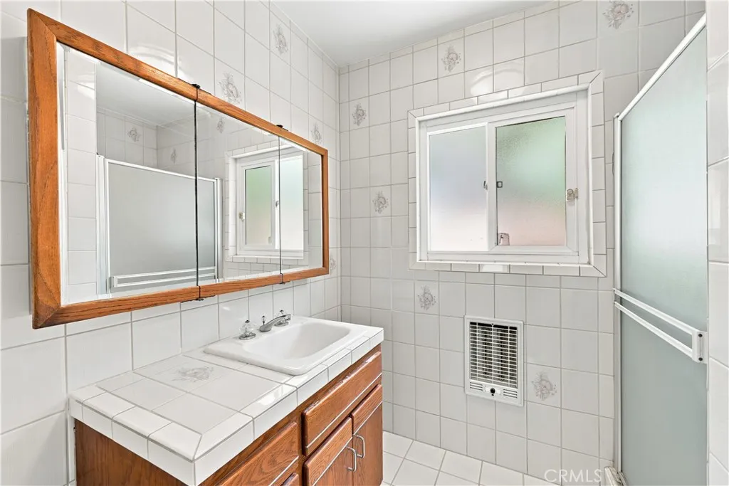 Primary bathroom with wall heater to keep warm on these cold days & nights