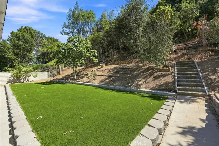 Stairs to the upper level of back yard