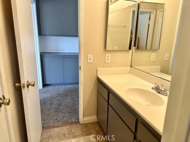 Full bath with access from hall and another door leads to the primary bedroom. Separate toilet and shower door
