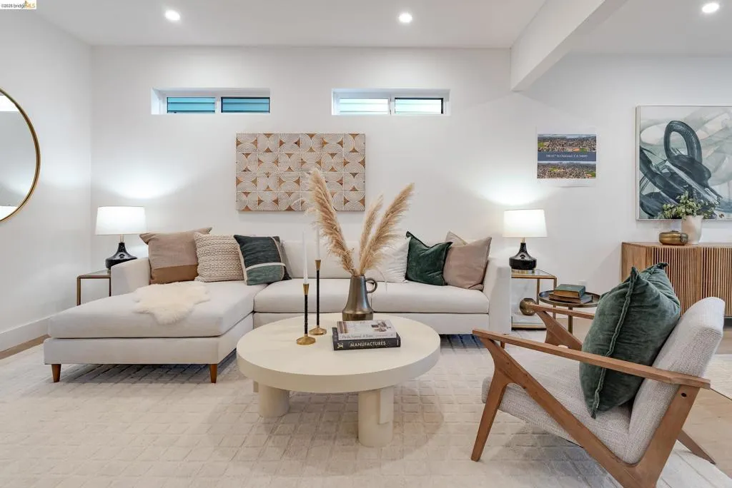 Bright living area featuring recessed lighting and high ceilings
