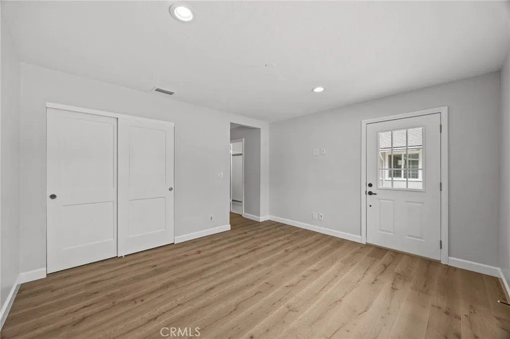 Secondary suite/bedroom #4 showing private entrance to front courtyard area