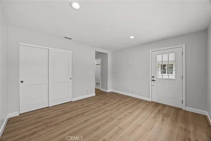 Secondary suite/bedroom #4 showing private entrance to front courtyard area