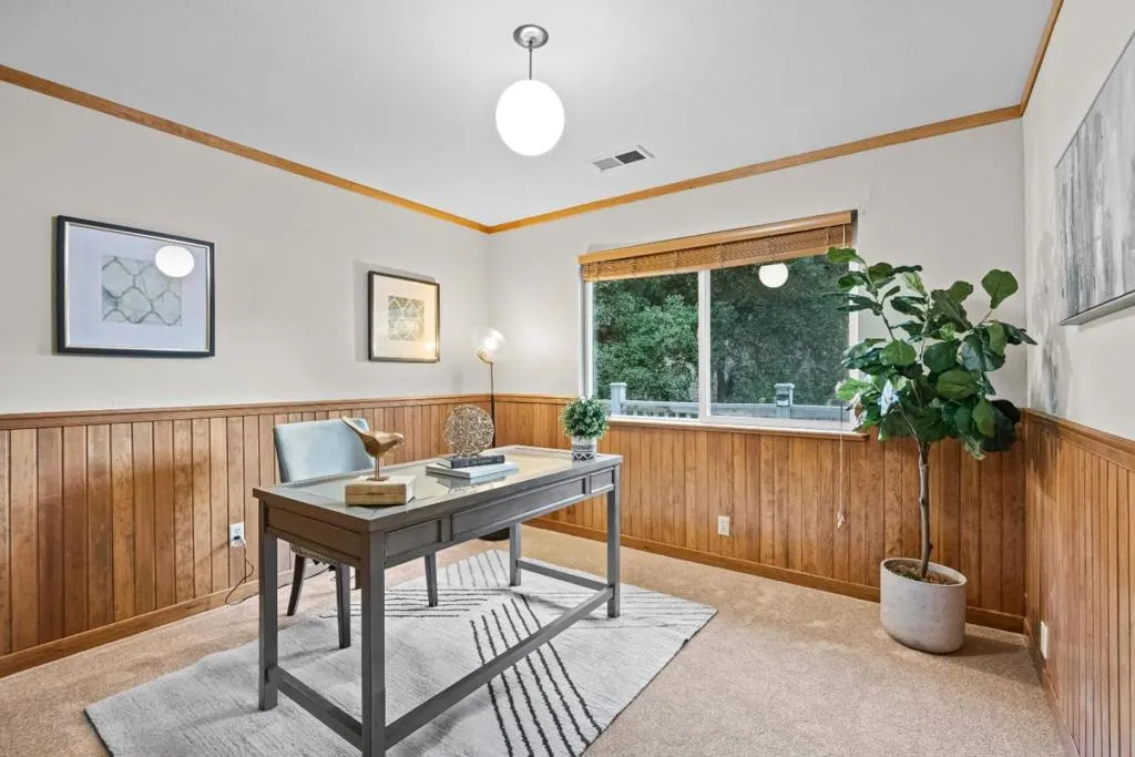 one of three bedrooms on this level; shown here as an office